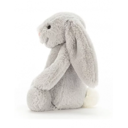 doudou lapin gris sur le coté